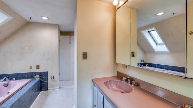 31 English Ln, Egg Harbor Township, NJ 08234 - bathroom featuring a skylight, vanity, a garden tub, tile patterned flooring, and recessed lighting