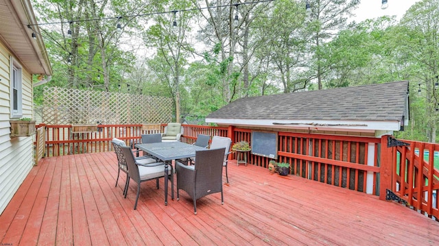 31 English Ln, Egg Harbor Township, NJ 08234 - wooden deck featuring outdoor dining area and view of wooded area
