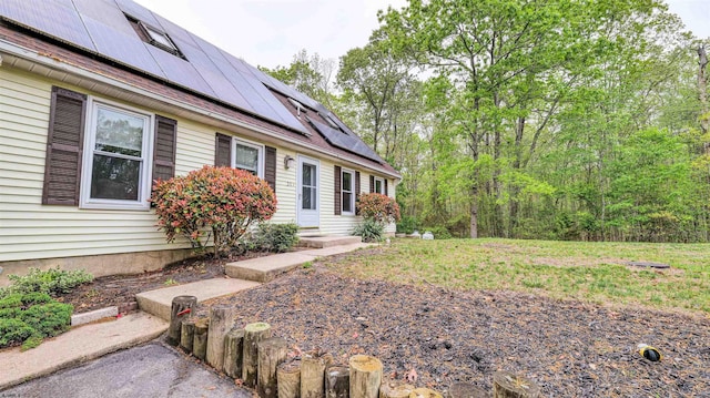 31 English Ln, Egg Harbor Township, NJ 08234 - view of property exterior featuring roof mounted solar panels and entry steps
