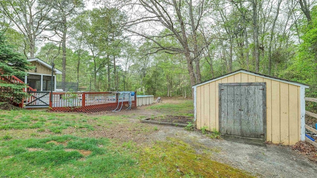 31 English Ln, Egg Harbor Township, NJ 08234 - view of yard with a shed, a wooden deck, and an outdoor structure