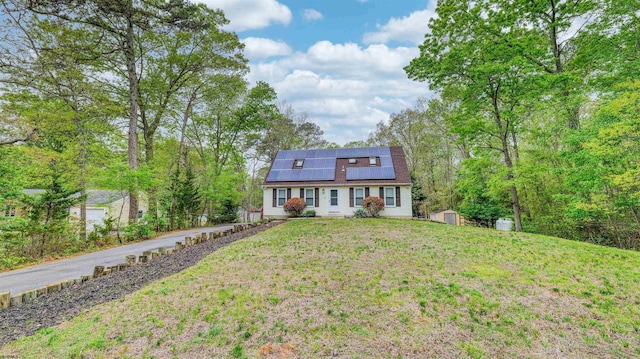 31 English Ln, Egg Harbor Township, NJ 08234 - view of front facade with a shed, roof mounted solar panels, an outbuilding, and a front yard