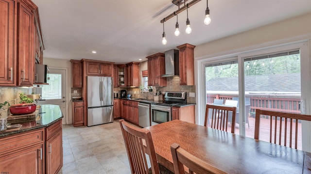 31 English Ln, Egg Harbor Township, NJ 08234 - kitchen with appliances with stainless steel finishes, wall chimney range hood, backsplash, brown cabinets, and recessed lighting