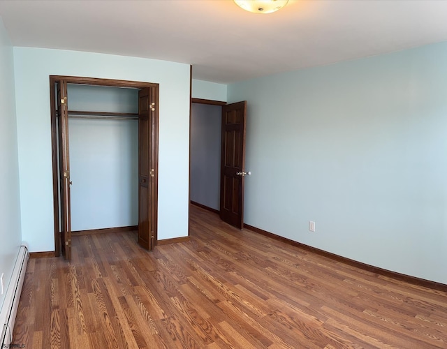 2910 Sunset Ave, Atlantic City, NJ 08401 - unfurnished bedroom featuring a baseboard radiator, wood finished floors, baseboards, and a closet