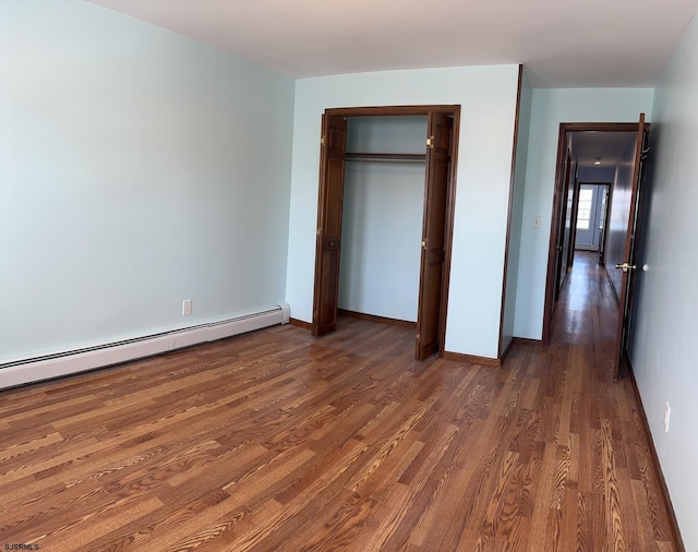 2910 Sunset Ave, Atlantic City, NJ 08401 - unfurnished bedroom with wood finished floors, a baseboard heating unit, baseboards, and a closet