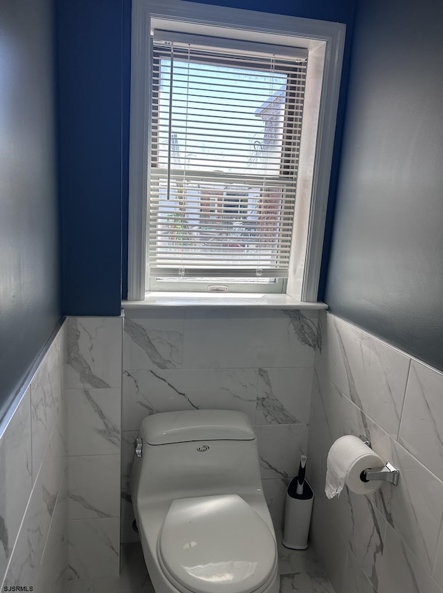 2910 Sunset Ave, Atlantic City, NJ 08401 - bathroom featuring tile walls, healthy amount of natural light, a wainscoted wall, toilet, and marble finish flooring