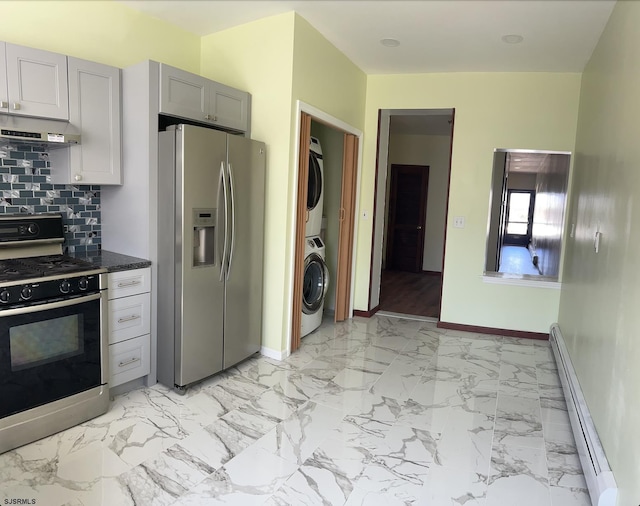 2910 Sunset Ave, Atlantic City, NJ 08401 - kitchen featuring stainless steel refrigerator with ice dispenser, gas stove, stacked washer and clothes dryer, baseboard heating, and under cabinet range hood