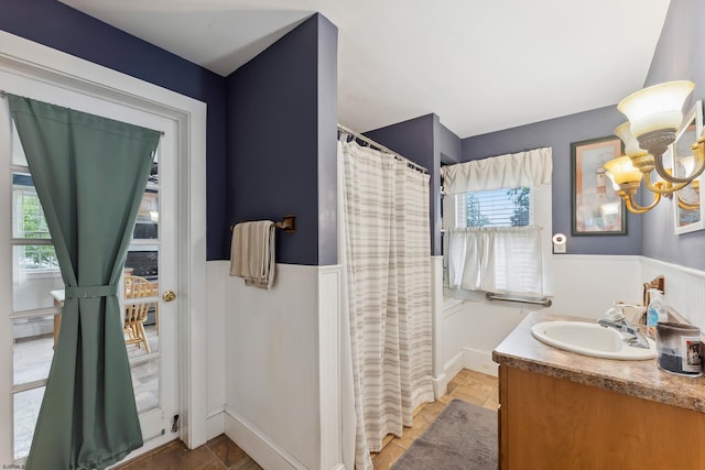 1224 Front St, Mauricetown, NJ 08329 - bathroom featuring a wainscoted wall, vanity, a chandelier, and curtained shower