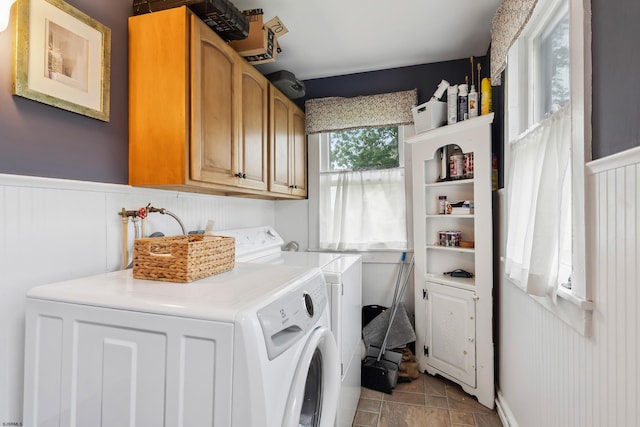 1224 Front St, Mauricetown, NJ 08329 - laundry area featuring washer and dryer, cabinet space, a wainscoted wall, and light tile patterned floors
