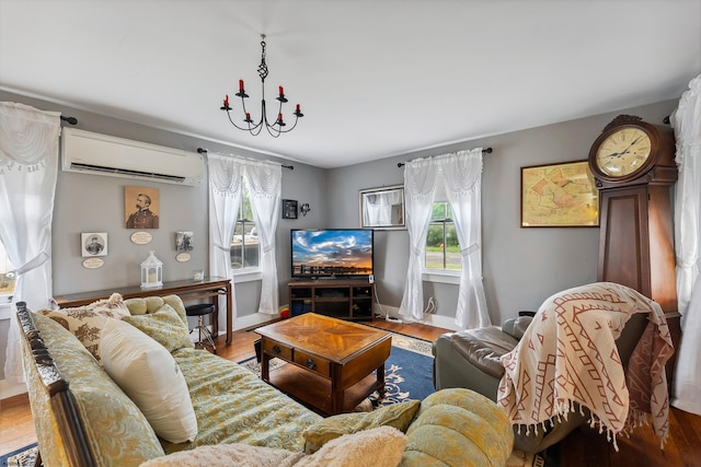 1224 Front St, Mauricetown, NJ 08329 - living area featuring a wall mounted AC, wood finished floors, baseboards, and a chandelier