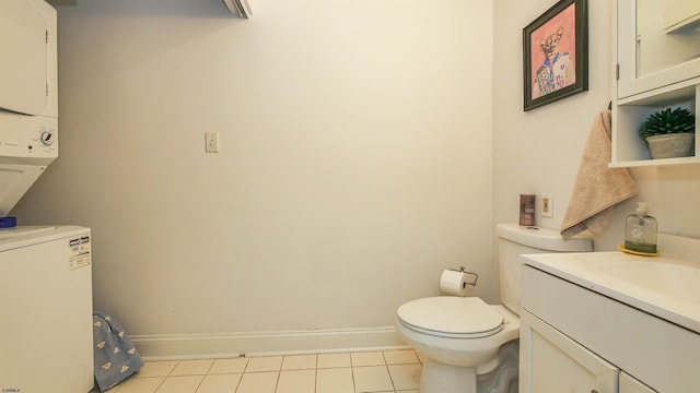 9402 Ventnor Ave, Margate, NJ 08402 - half bath featuring stacked washer and clothes dryer, tile patterned flooring, baseboards, toilet, and vanity