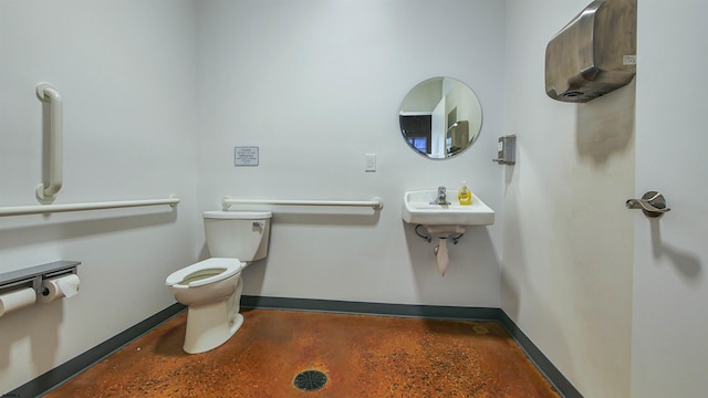 9402 Ventnor Ave, Margate, NJ 08402 - bathroom with toilet, baseboards, and concrete floors