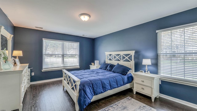 628 E Regency Dr Unit 628, Galloway Township, NJ 08205 - bedroom featuring multiple windows, baseboards, and dark wood finished floors