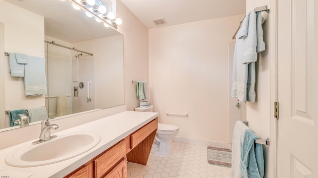 628 E Regency Dr Unit 628, Galloway Township, NJ 08205 - full bathroom featuring a stall shower, vanity, toilet, tile patterned flooring, and baseboards