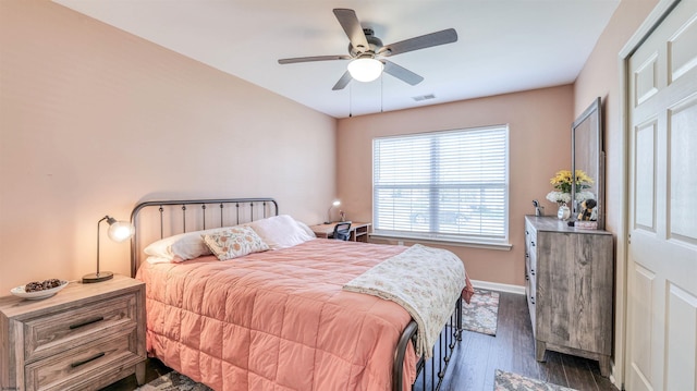 628 E Regency Dr Unit 628, Galloway Township, NJ 08205 - bedroom featuring dark wood-style floors, ceiling fan, and baseboards