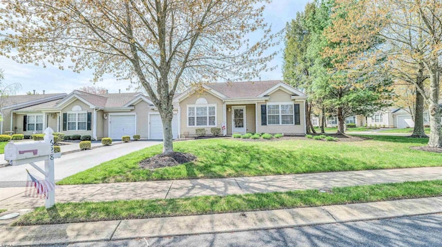 628 E Regency Dr Unit 628, Galloway Township, NJ 08205 - single story home featuring asphalt driveway, a garage, and a front lawn
