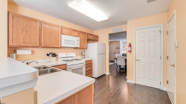 628 E Regency Dr Unit 628, Galloway Township, NJ 08205 - kitchen with white appliances, a sink, light countertops, dark wood-type flooring, and light brown cabinets