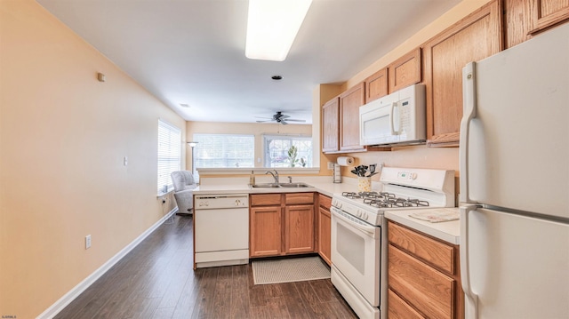 628 E Regency Dr Unit 628, Galloway Township, NJ 08205 - kitchen with white appliances, a sink, dark wood finished floors, light countertops, and baseboards