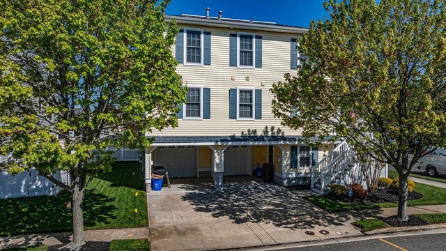 802 Coolidge Rd Unit 2, Ocean City, NJ 08226 - multi unit property with a garage, concrete driveway, and a front yard