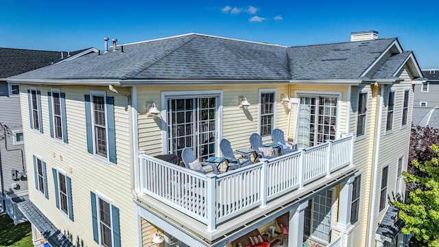802 Coolidge Rd Unit 2, Ocean City, NJ 08226 - rear view of house with a shingled roof and a chimney