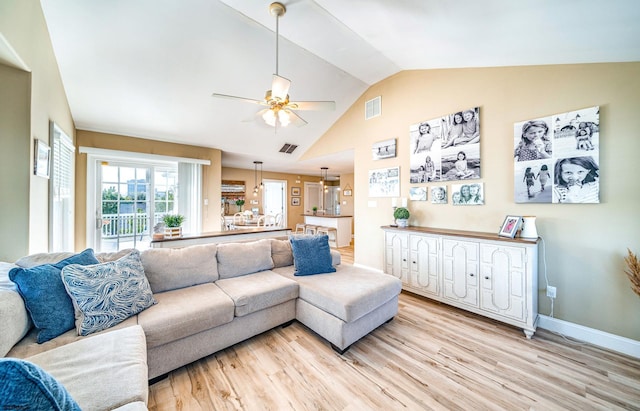 802 Coolidge Rd Unit 2, Ocean City, NJ 08226 - living room with vaulted ceiling, a ceiling fan, light wood-style floors, and baseboards
