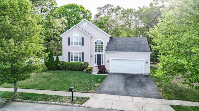 223 Churchill Dr, Egg Harbor Township, NJ 08234 - traditional-style home featuring driveway, a garage, and a front lawn