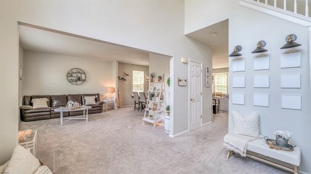223 Churchill Dr, Egg Harbor Township, NJ 08234 - carpeted living room featuring baseboards and a high ceiling