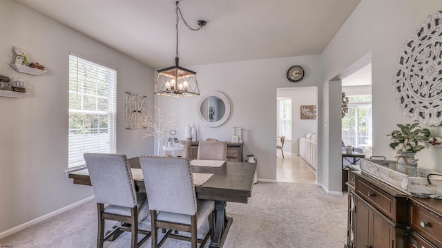 223 Churchill Dr, Egg Harbor Township, NJ 08234 - dining room featuring a chandelier, light colored carpet, and baseboards