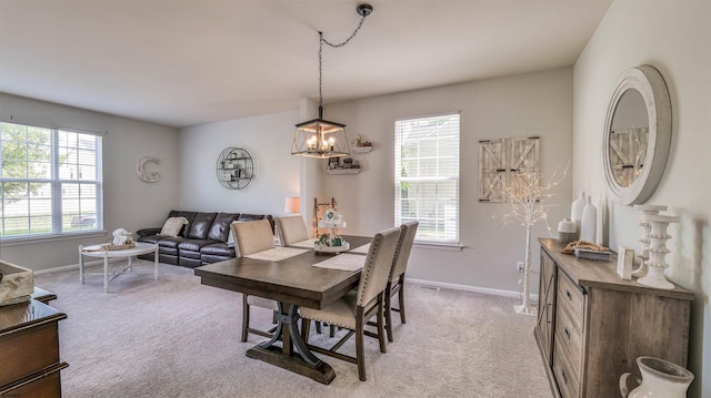223 Churchill Dr, Egg Harbor Township, NJ 08234 - dining room featuring plenty of natural light, light carpet, and baseboards