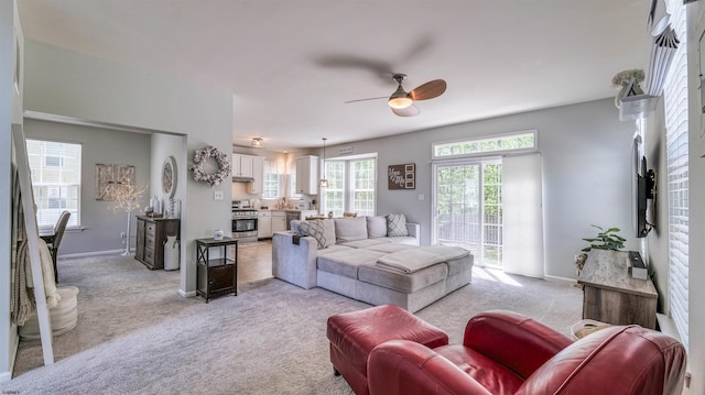 223 Churchill Dr, Egg Harbor Township, NJ 08234 - living room with ceiling fan, light carpet, and baseboards