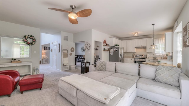223 Churchill Dr, Egg Harbor Township, NJ 08234 - living area featuring ceiling fan and light colored carpet