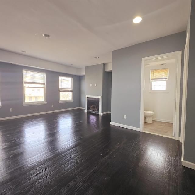 206 N S Carolina Ave, Atlantic City, NJ 08401 - unfurnished living room featuring plenty of natural light, wood finished floors, a fireplace, and recessed lighting