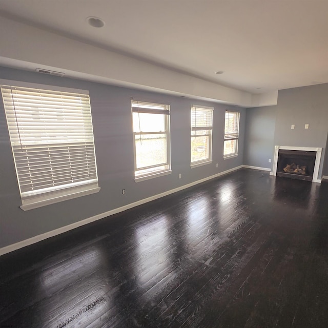 206 N S Carolina Ave, Atlantic City, NJ 08401 - unfurnished living room featuring wood finished floors, baseboards, and a fireplace