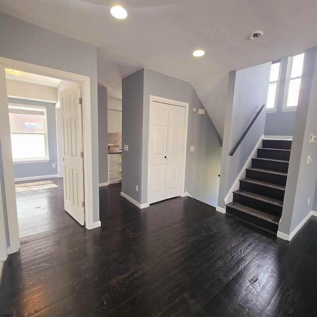 206 N S Carolina Ave, Atlantic City, NJ 08401 - unfurnished living room featuring stairs, baseboards, dark wood-style flooring, and recessed lighting