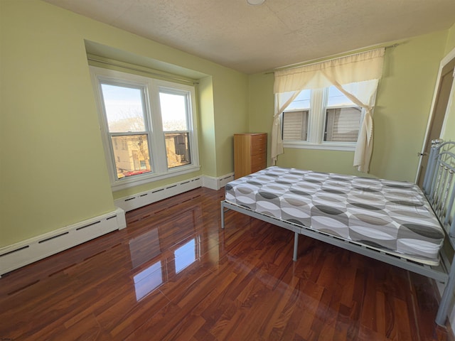 118 N Portland Ave, Ventnor, NJ 08406 - bedroom with a textured ceiling, wood finished floors, a baseboard radiator, and baseboards