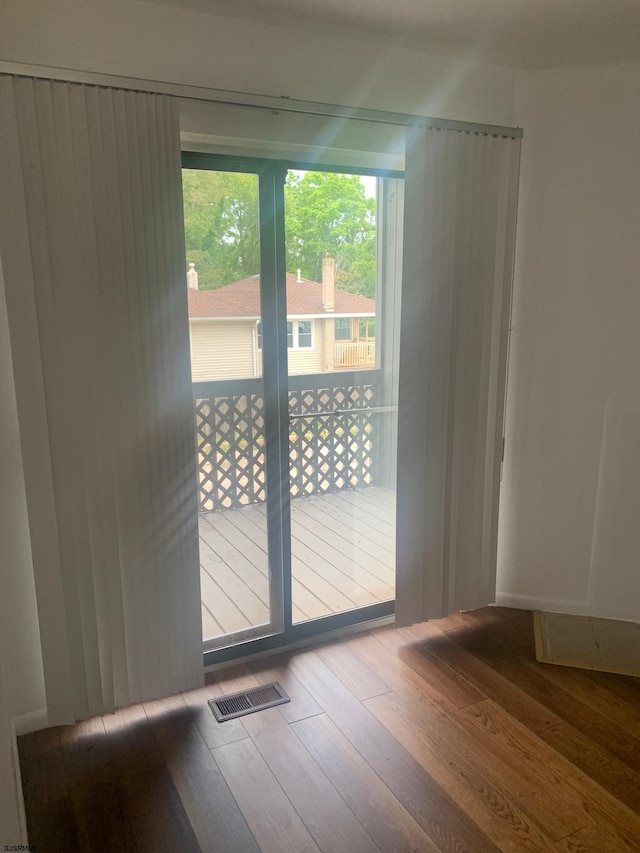 doorway featuring wood-type flooring