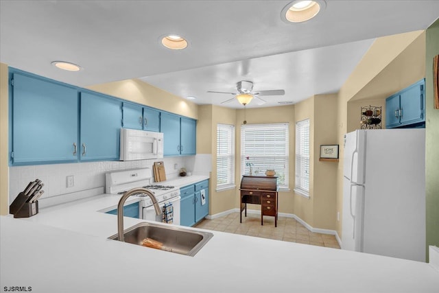 669 E Lake Front Cir Unit 669, Smithville, NJ 08205 - kitchen with white appliances, blue cabinetry, a sink, ceiling fan, and light countertops