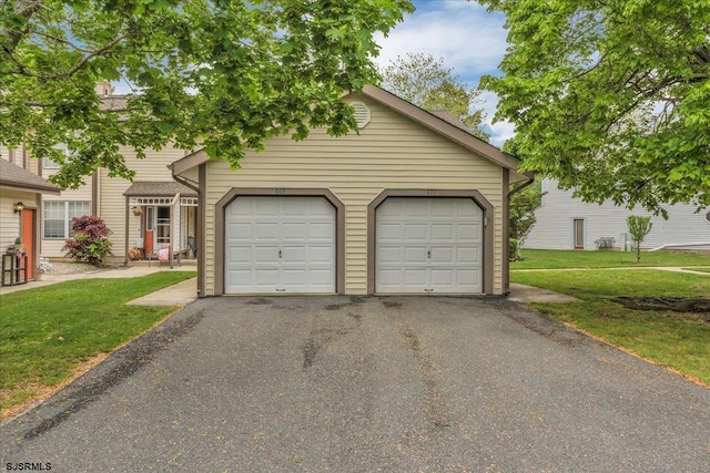 669 E Lake Front Cir Unit 669, Smithville, NJ 08205 - view of front of property with a front lawn and a garage