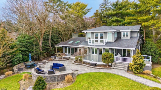 229 Landing Ln, Linwood, NJ 08221 - back of property featuring an outdoor living space with a fire pit, roof with shingles, a yard, a patio, and covered porch