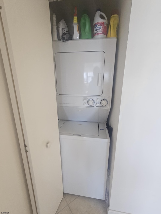 3101 Boardwalk Unit 2409-2, Atlantic City, NJ 08401 - laundry room with stacked washer and clothes dryer and light tile patterned flooring