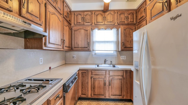 711 N Ohio Ave, Atlantic City, NJ 08401 - kitchen featuring white fridge with ice dispenser, a sink, under cabinet range hood, gas cooktop, and brown cabinetry