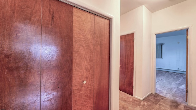 711 N Ohio Ave, Atlantic City, NJ 08401 - hall with carpet, a baseboard heating unit, and baseboards