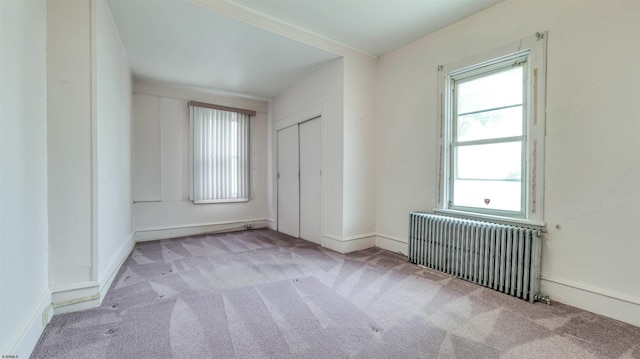 711 N Ohio Ave, Atlantic City, NJ 08401 - unfurnished bedroom with radiator, carpet floors, baseboards, and a closet