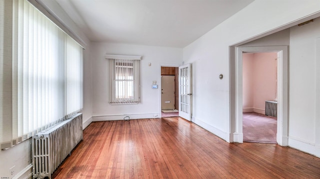 711 N Ohio Ave, Atlantic City, NJ 08401 - empty room featuring radiator, hardwood / wood-style flooring, and baseboards