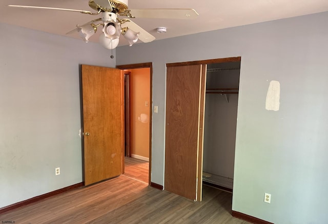 205 Country Ln, Galloway Township, NJ 08205 - unfurnished bedroom featuring wood finished floors, a closet, baseboards, and a ceiling fan