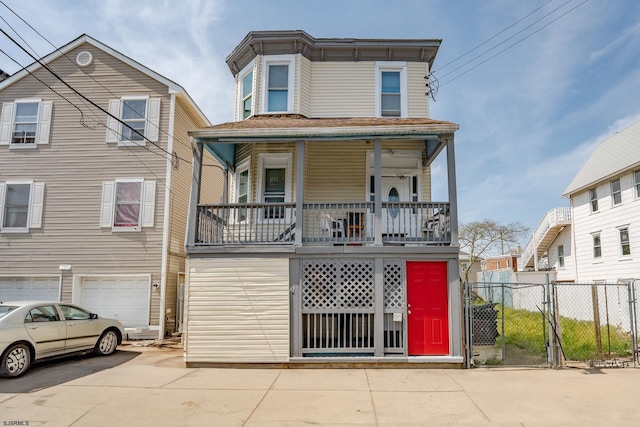 32 N Florida Ave, Atlantic City, NJ 08401 - view of front of property with driveway, fence, an attached garage, a gate, and covered porch