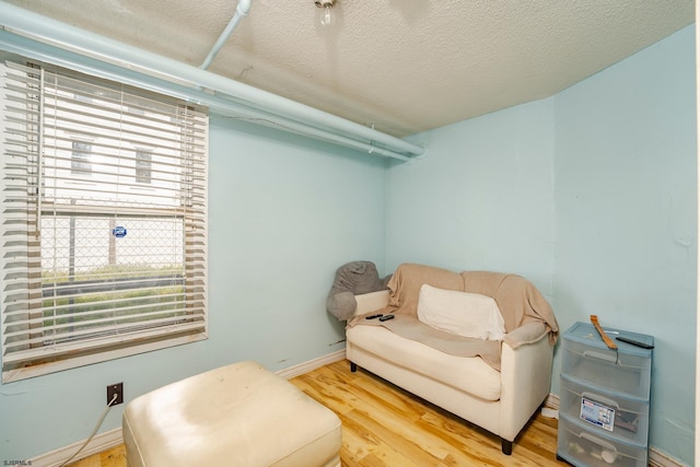 32 N Florida Ave, Atlantic City, NJ 08401 - sitting room with wood finished floors, a textured ceiling, and baseboards