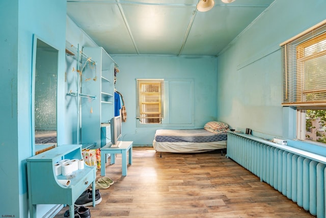 32 N Florida Ave, Atlantic City, NJ 08401 - bedroom featuring radiator heating unit and wood finished floors