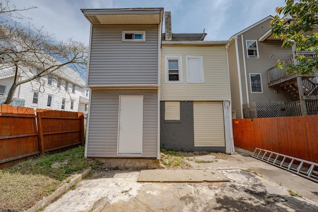 32 N Florida Ave, Atlantic City, NJ 08401 - rear view of house featuring a fenced backyard and brick siding