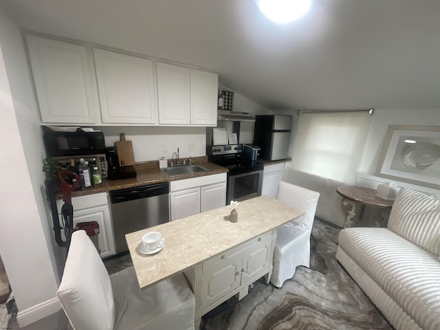 27 E Pierson Ave, Somers Point, NJ 08244 - kitchen with appliances with stainless steel finishes, a sink, white cabinets, vaulted ceiling, and under cabinet range hood