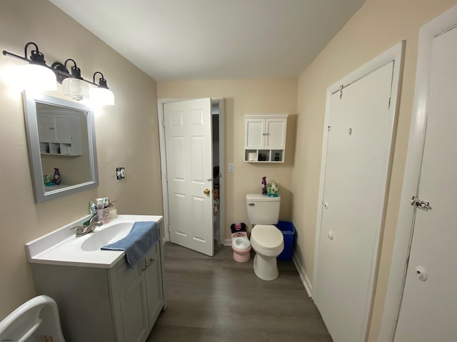 27 E Pierson Ave, Somers Point, NJ 08244 - bathroom with wood finished floors, toilet, vanity, and baseboards